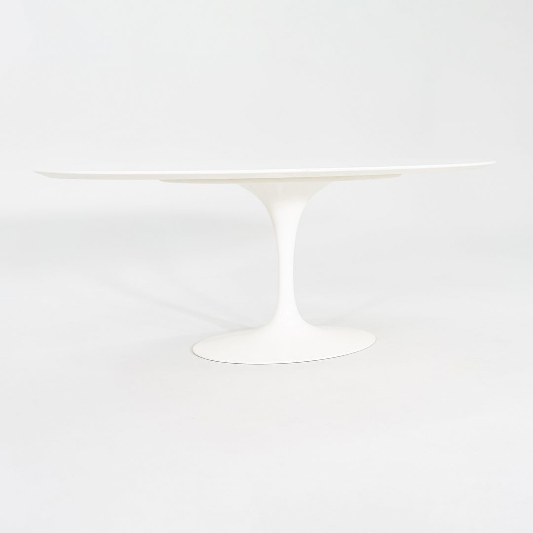 2010s Eero Saarinen for Knoll 78x48 inch Oval Dining table in White Laminate