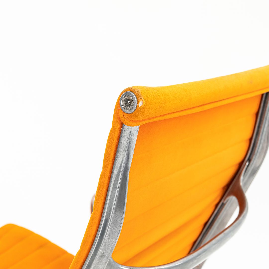 1970s Eames Aluminum Group Lounge Chair, model EA124 by Ray and Charles Eames for Herman Miller in Orange Alexander Girard-Designed Hopsack Fabric