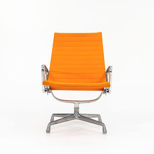 SOLD 1970s Eames Aluminum Group Lounge Chair, model EA124 by Ray and Charles Eames for Herman Miller in Orange Alexander Girard-Designed Hopsack Fabric