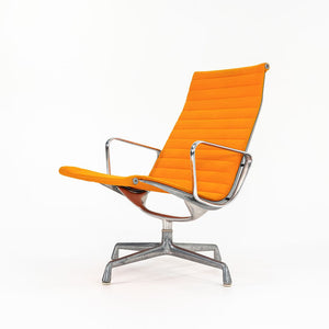 1970s Eames Aluminum Group Lounge Chair, model EA124 by Ray and Charles Eames for Herman Miller in Orange Alexander Girard-Designed Hopsack Fabric