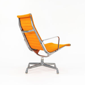 SOLD 1970s Eames Aluminum Group Lounge Chair, model EA124 by Ray and Charles Eames for Herman Miller in Orange Alexander Girard-Designed Hopsack Fabric