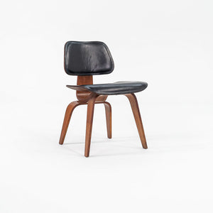 1952 DCW Dining Chair by Charles and Ray Eames for Herman Miller in Walnut with Black Leather Upholstery