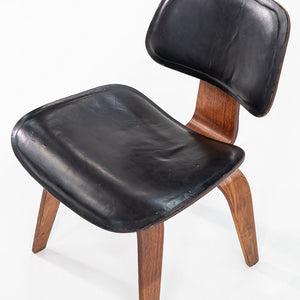 1952 DCW Dining Chair by Charles and Ray Eames for Herman Miller in Walnut with Black Leather Upholstery