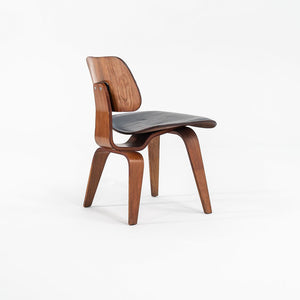 1952 DCW Dining Chair by Charles and Ray Eames for Herman Miller in Walnut with Black Leather Upholstery