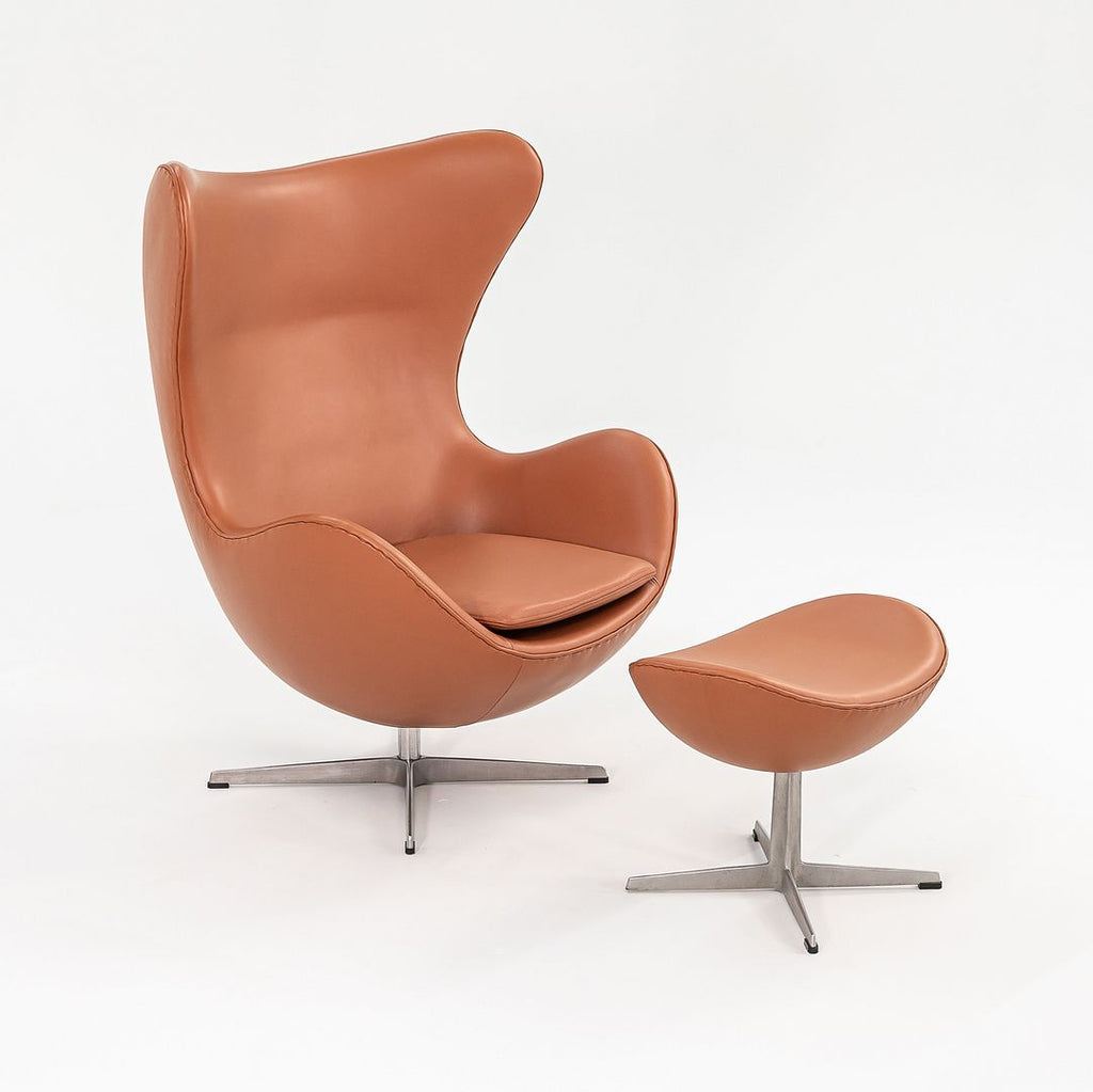 1990s Egg Lounge Chair and Ottoman by Arne Jacobsen for Fritz Hansen in New Cognac Leather