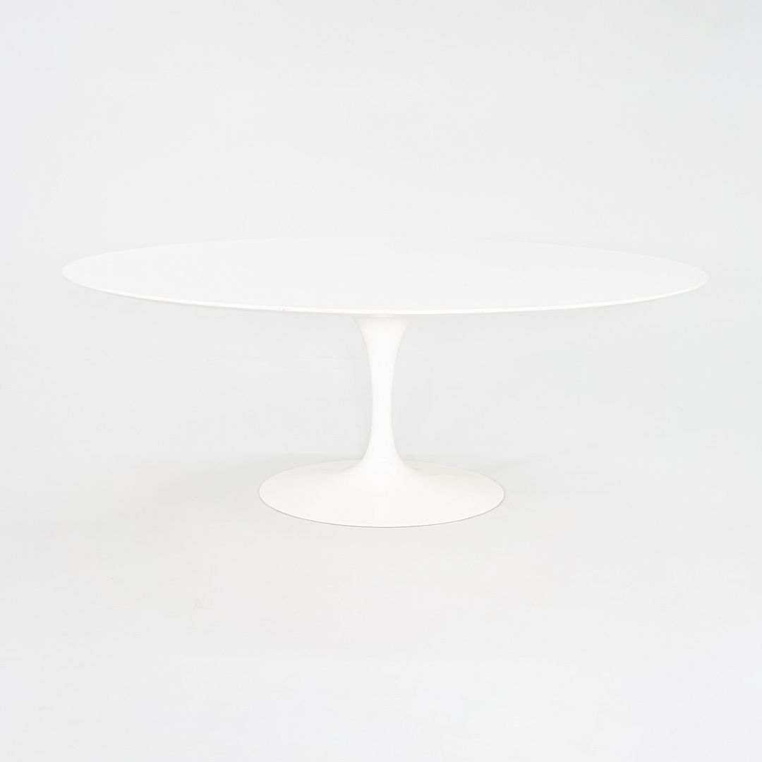 2010s Eero Saarinen for Knoll 78x48 inch Oval Dining table in White Laminate