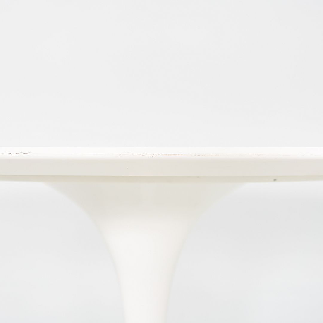 2010s Eero Saarinen for Knoll 78x48 inch Oval Dining table in White Laminate