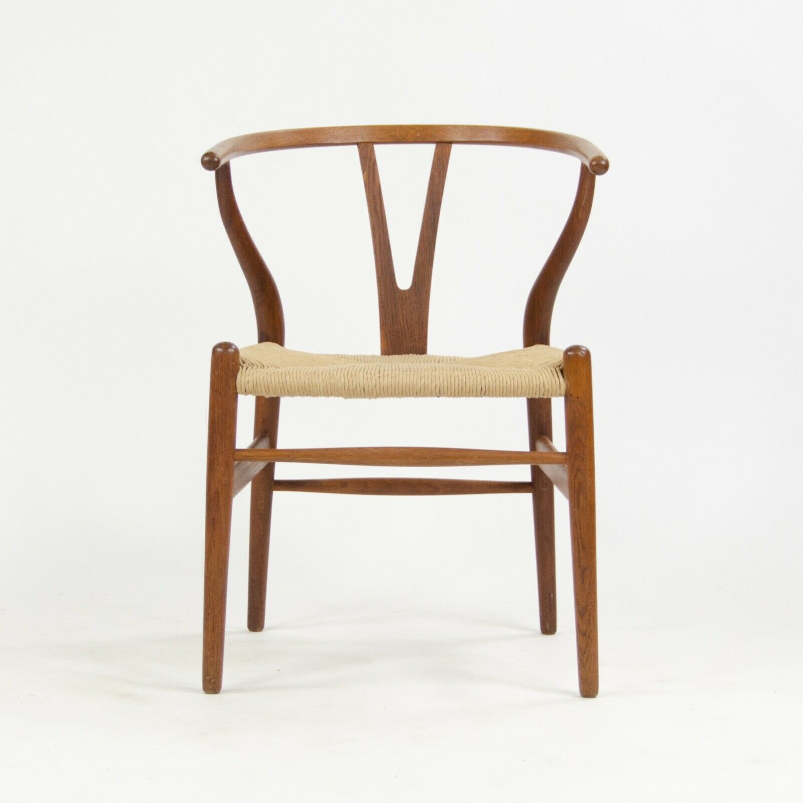 SOLD 1960s Set of Eight Hans Wegner Wishbone Chairs for Carl Hansen of Denmark in Oak